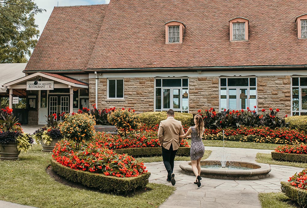A couple heading towards Queenston Heights Restaurant for brunch