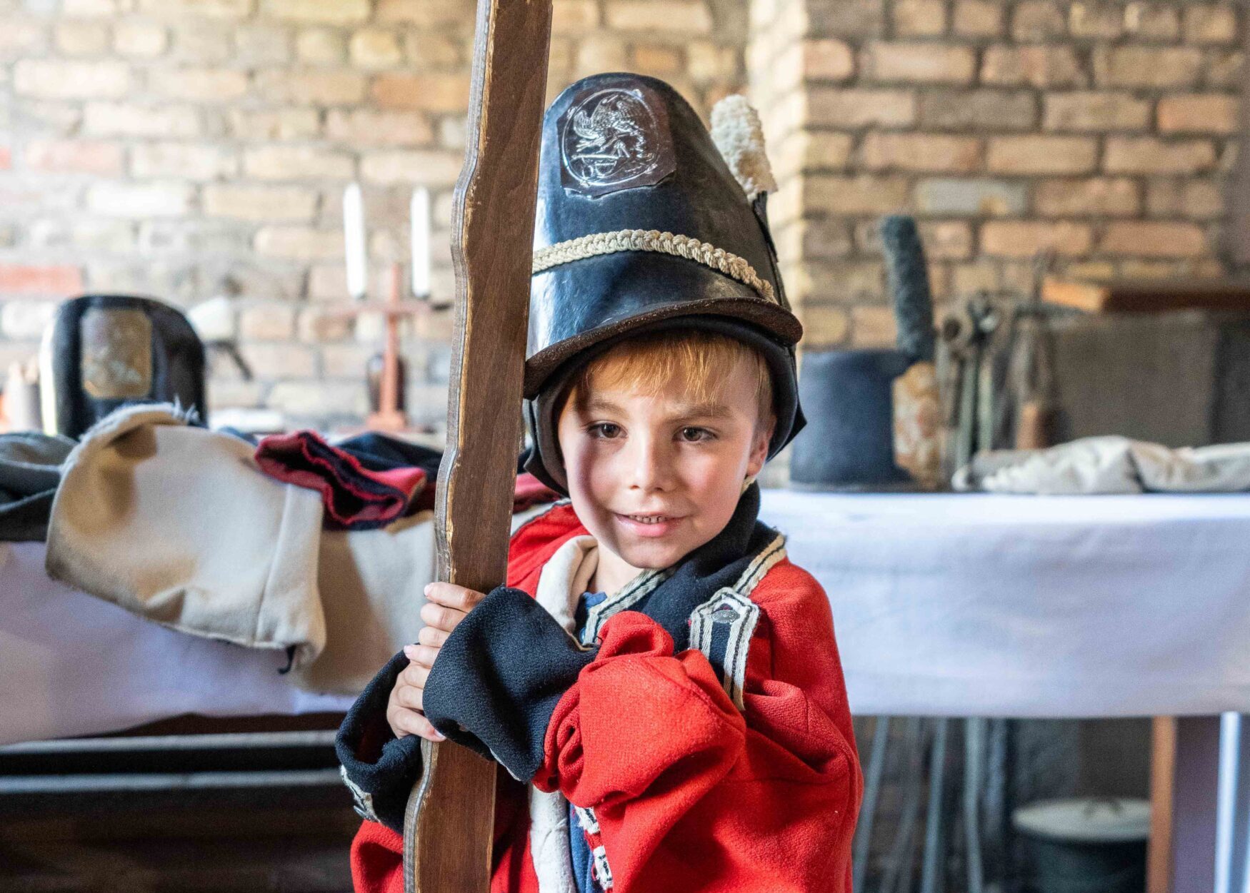 A child dressed in a British Soldiers uniform